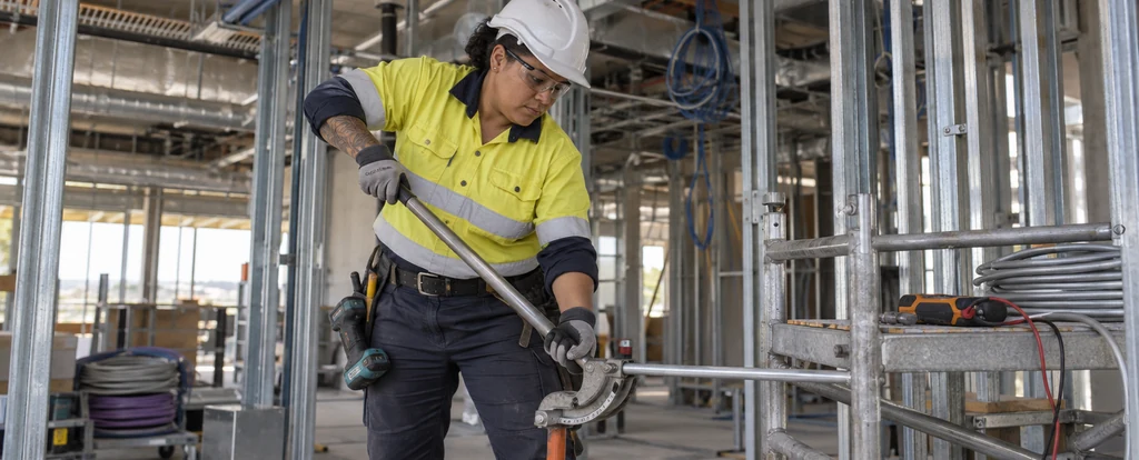 Illustration of a person working as an electrical trades assistant